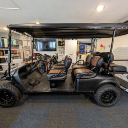 LIFTED 6-SEAT MATTE BLACK ELECTRIC GOLF CART 