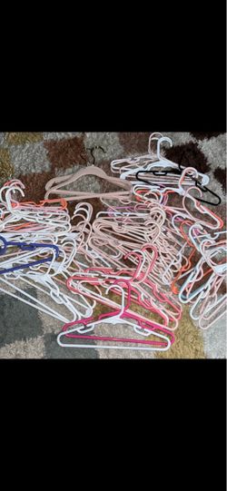60 kids size plastic hangers. 2 velvet ones. $10