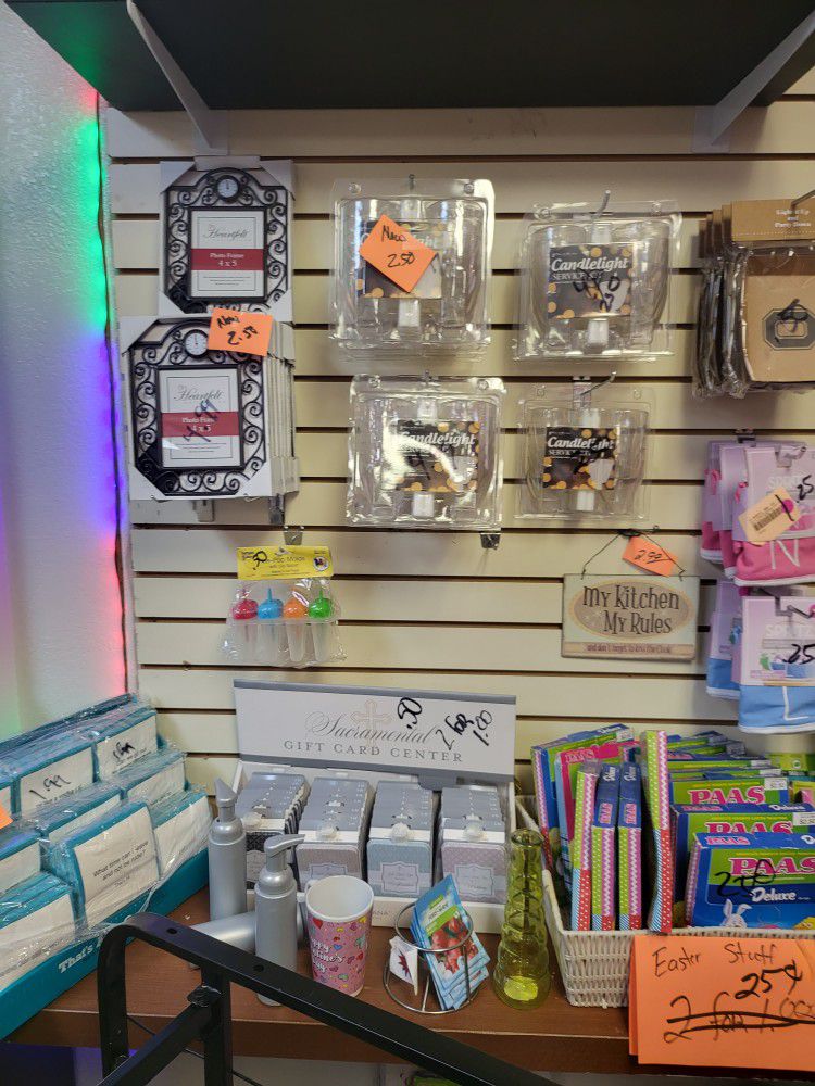 Candle holding kids and candles $2.50 50 cents pitcher frame clock $2.50 entire store 50% off