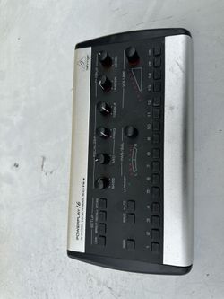 Behringer Powerplay P16-M 16-channel digital personal mixer featuring a silver and black design