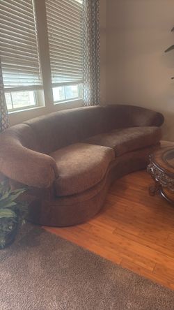 Brown rounded couches