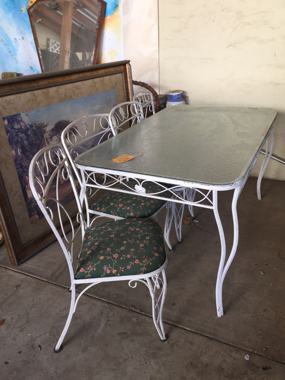 Patio table with 4 chairs..vintage..wrought iron..pay $53 now an balance end of month..full price $150..no credit check no interest