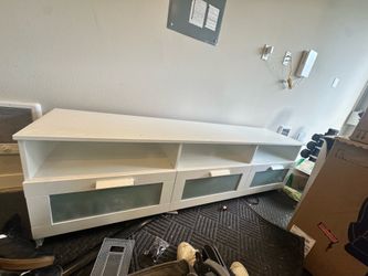 Ikea tv console with 3 drawers.