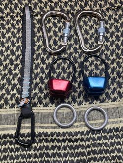 Set of Black Diamond locking D-rings, descenders and climbing rings.