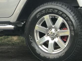 Stock upgraded Jeep Wrangler Unlimited rims. Taking of my 2013 Wrangler. In great shape. Tires have good tread left on them.