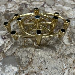Elegant gold candle holder with nine slots