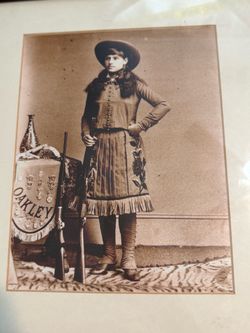 Annie Oakley and western town from the 1800s framed art