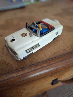 Vintage tin lithograph police no. 3 toy car.