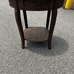 Rattan  Oval End Side Table. With a Drawer  24” wide  18” deep  26” tall  