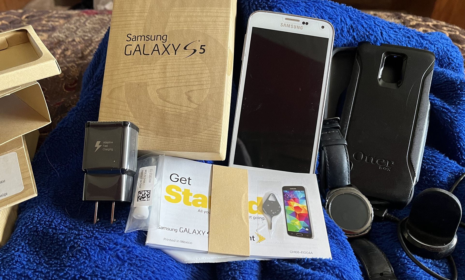 Samsung Galaxy S5 Phone And Gear S2 Watch