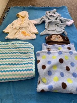 2 baby robes (0-9 months), Baby blanket with attached monkey hat, and Baby blanket