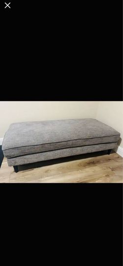 Spacious gray ottoman