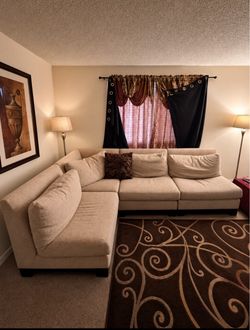 beige sectional L shaped couch