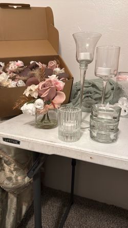 9 small floral arrangements and votive candle holders