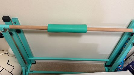 Gymnastics bar with mat