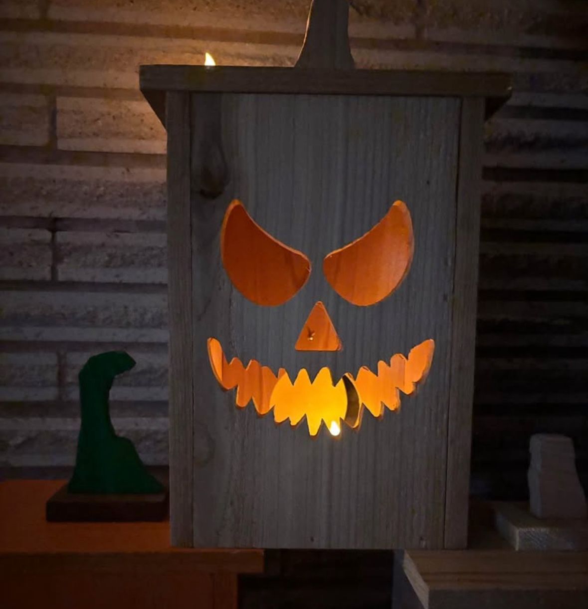 Wooden jack o lanterns! Lots of faces to pick from, comes with LED candle