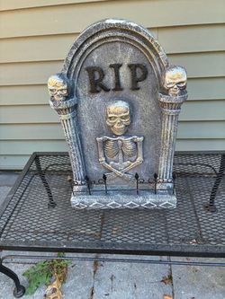 22”H resin type cemetery sculpture good used cond w/skelaton on front