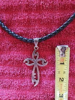 Silver cross/black leather necklace