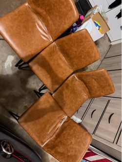 4 faux leather dining chairs