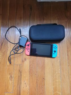 Nitendo switch with NEW CASE AND CHARGER