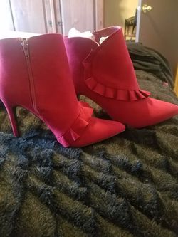 Red high-heeled ankle boots