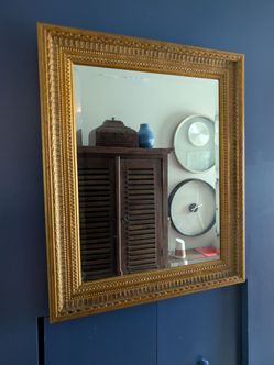 Carved gold mirror