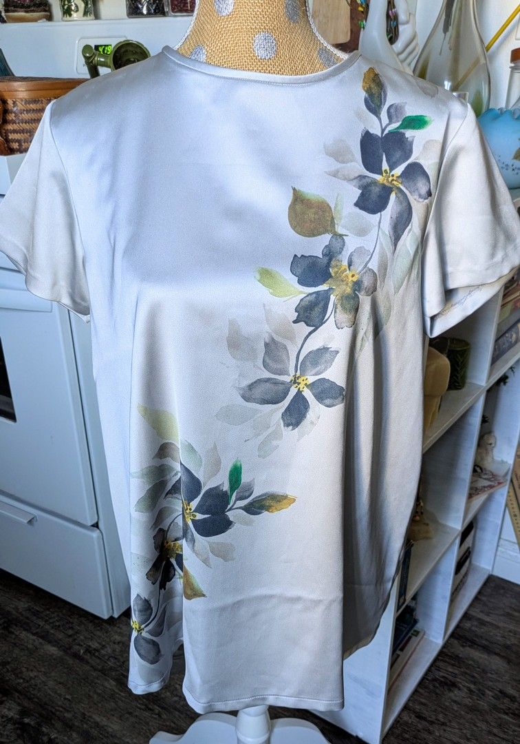 IE Butik floral satin blouse NWT Elegant satin-feel top with soft hand-drawn floral print in gray, green & gold tones. Lightweight & flowy—perfect
