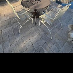 $200  IRON 4 ROCKING CHAIRS AND TABLE 