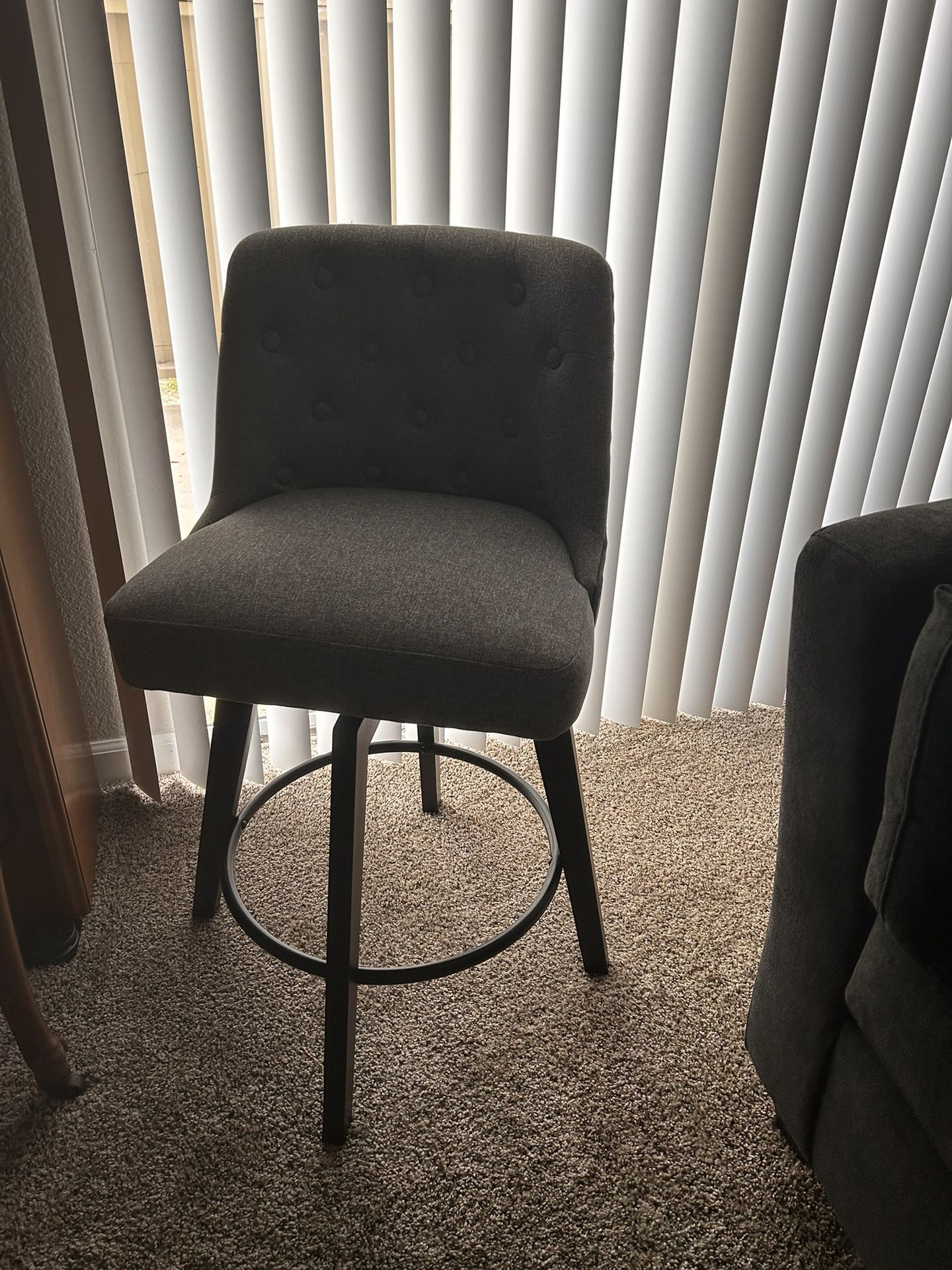 Grey cushioned Swivel Chair