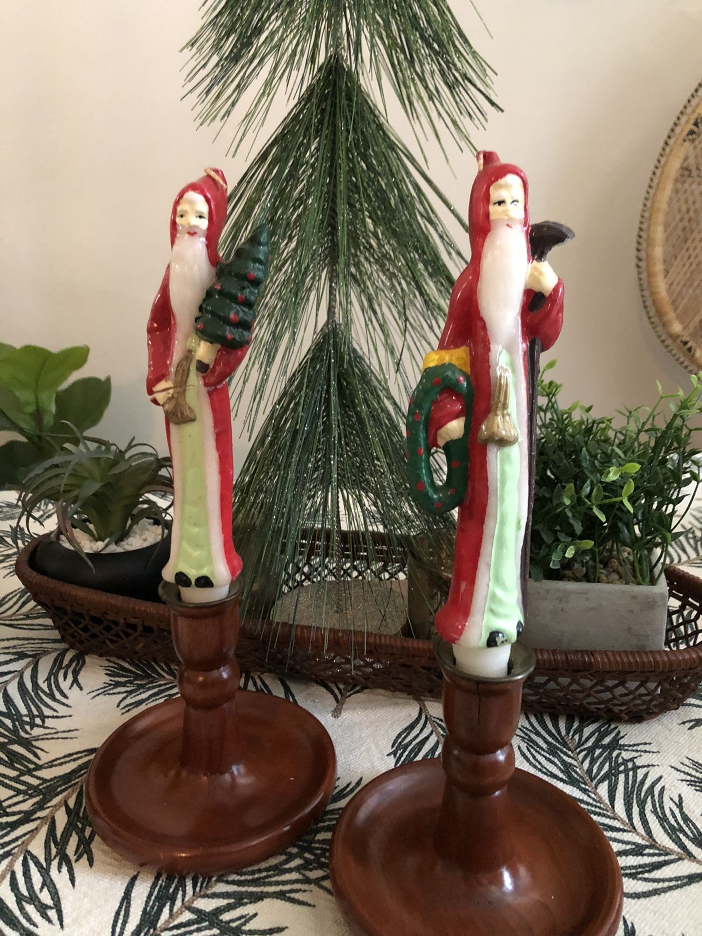 Set of two mid Century wooden candle sticks with vintage Santa candles