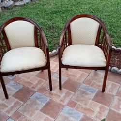 A PAIR OF VINTAGE ART DECO SOLID WOOD CHAIRS.