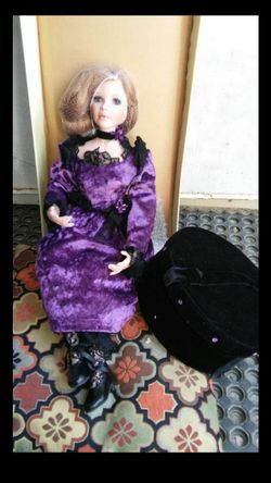 Porcelain Doll Violet comes with certificate of Authenticity she also has her own hat box