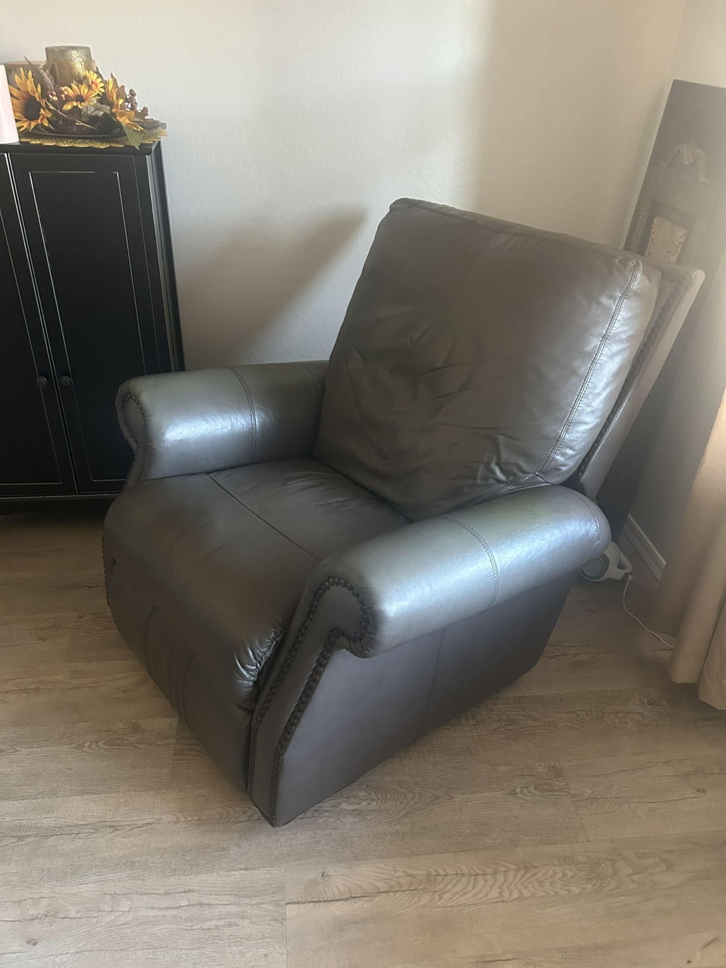 Gray leather rocker/recliner