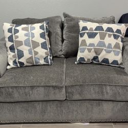 Dark grey love seat