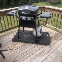 BBQ Grill and Propane Tank.