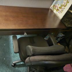 Dark Walnut Desk And Black Office Rolling Chair With Lumbar Seat Cushions