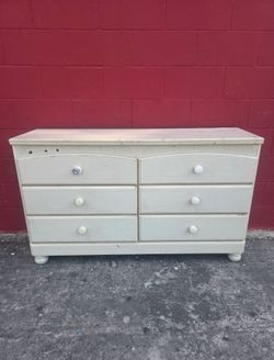 Used kids dresser, not real wood, the 6 drawers work good and are on track, compressed wood but sturdy and stable, great for a kids room, truck or suv