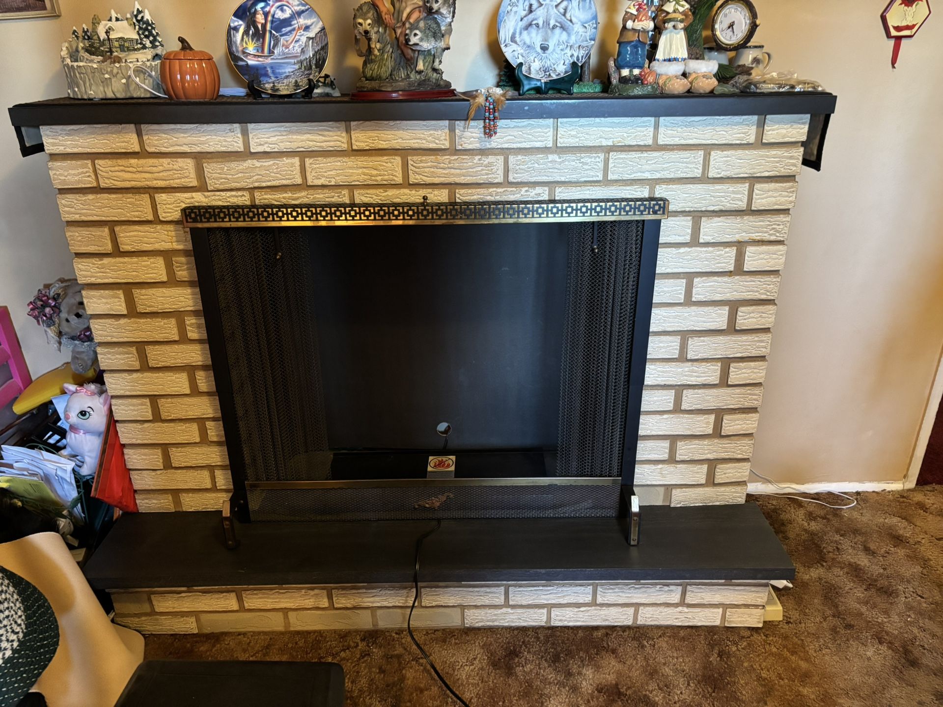 Decorative mantle just the shell there’s no fireplace