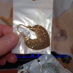 Fish Hook Dangle Earring Gold In Color With A Filagree Look.