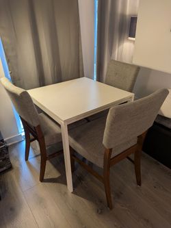 White Dining Table with 3 Upholstered Chairs