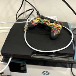 PS4 Slim 150GB + 4 Games (controllers and cables Included)
