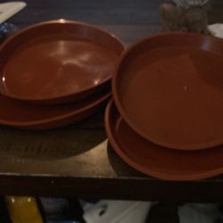 Four planters bottoms, plastic