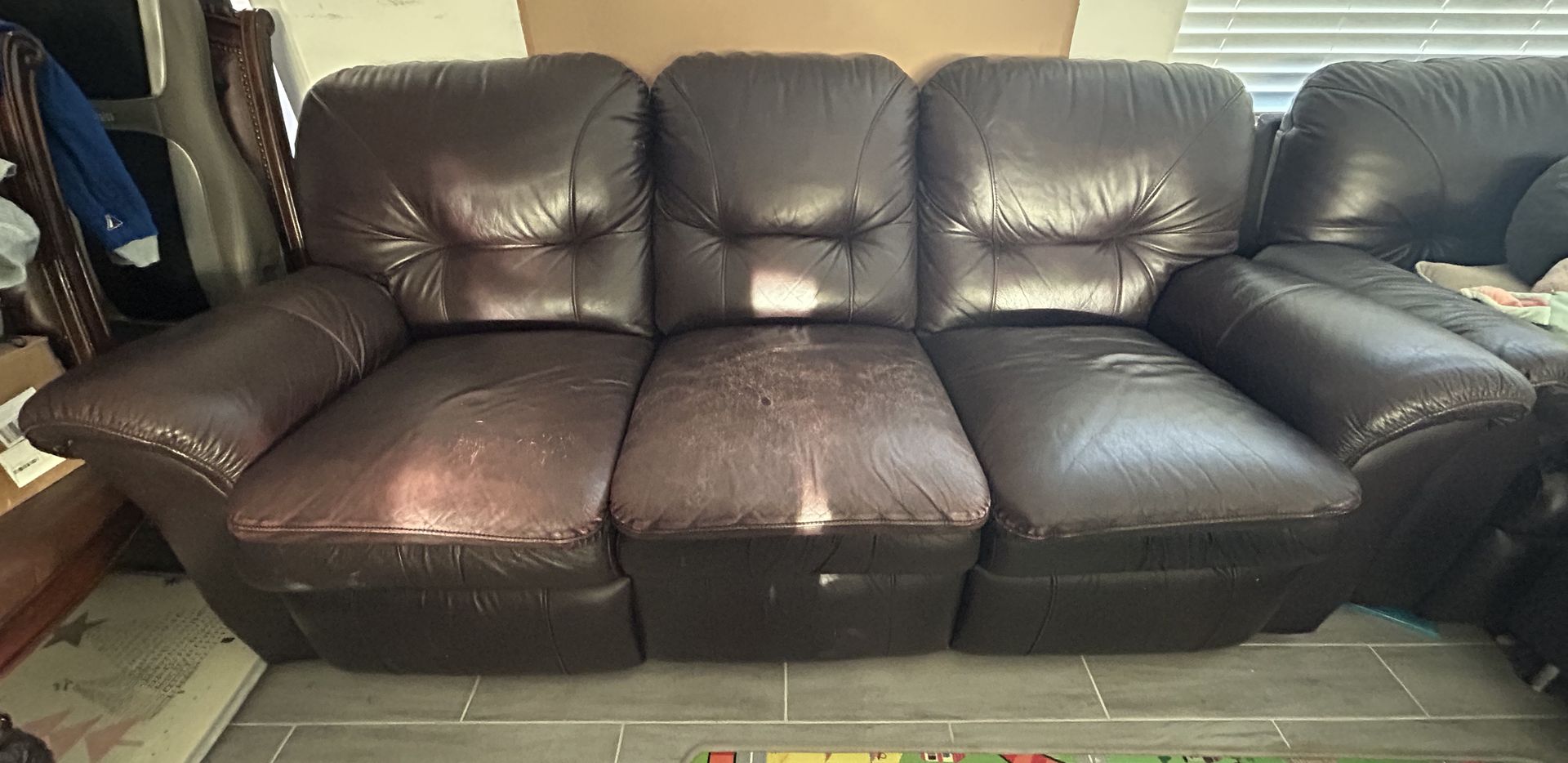 Brown leather couch with recliner