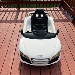 White Audi R8 GT Spyder ride-on toy car for kids