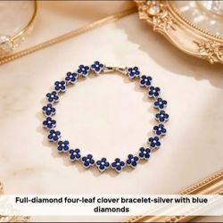 Silver Four-Leaf Clover Bracelet with Blue Stones