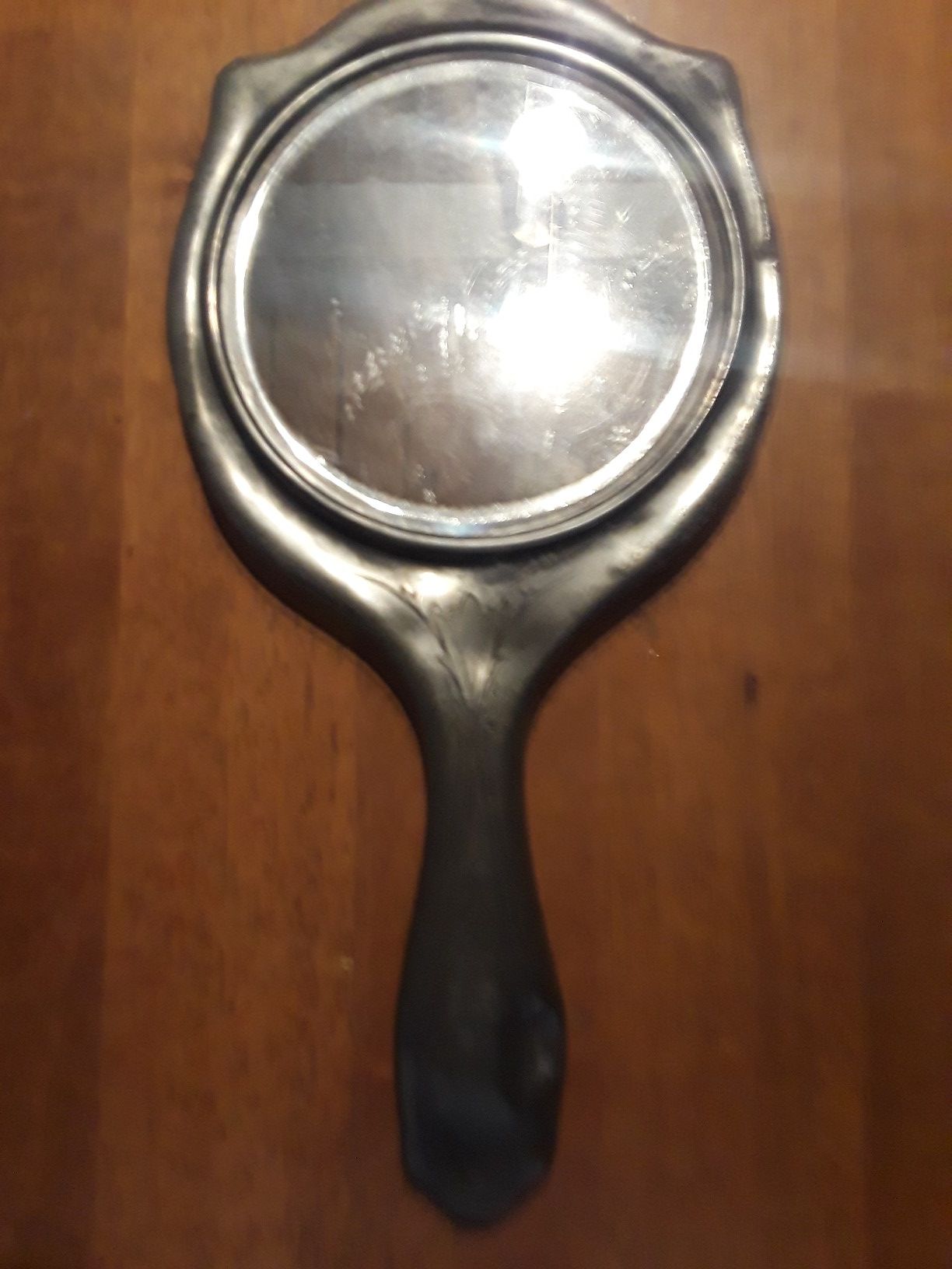 Old pewter hand mirror