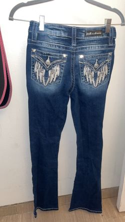 Flared jeans with angle wing detail