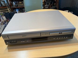Silver Toshiba SD-V280 is a combination DVD player and VHS Hi-Fi video cassette recorder. It has front-facing RCA audio/video inputs, channel selectio