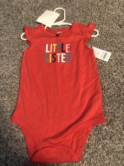 Carter’s brand size 12 month brand new onesie that was never worn