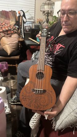 ( no lowballing firm on price not mine)Luna Ukulele with Tribal Engraving